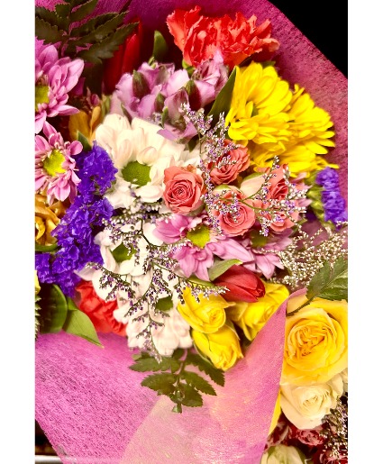 Bring a smile to your  special person wrapped mix flowers for pick up only