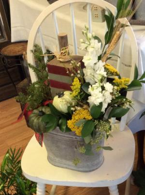 Thanksmas  custom galvanized container with historical barn wood pumpkin, artificial cedar tree, and fresh flowers that can be changed for the season