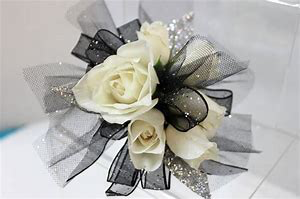 The Classic Corsage This can be made in any color. Picture is for reference only.  Please call with you color change.