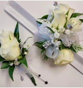 The couple package.  Wrist Corsage and Boutonniere