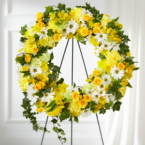 The FTD Golden Remembrance Wreath Standing Spray