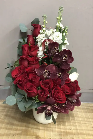 The Queen Lavish orchid and rose arrangement