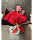 The Runway Rose red roses in a vase