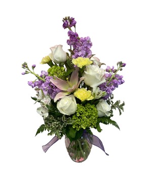 The Tracie Lynn Mixed fresh flowers in a clear tall vase