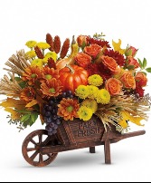 This fun fall arrangement features yellow button c 