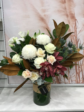 Tiffany including vase with orchids and strong choice of long lasting flowers.