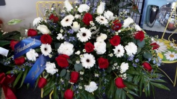 Touch of blue Red roses, white gerbera daisies, white carnations Monte cassino blue delphinium white roses in North Salem, IN | Garden Gate Gift & Flower Shop
