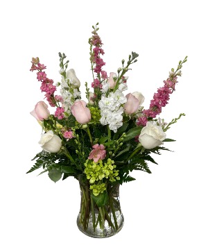 Think pink! Mixed fresh flowers in a clear gathering vase