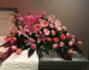 Tribute spray in pink and coral Casket Spray of Funeral Flowers
