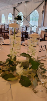 Triple candles with orchid and a floating candle  Centerpiece