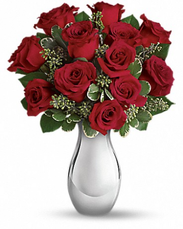 True Romance bouquet Turn up the heat on a new romance - or a lifelong love affair - with this classic composition. It features one dozen of our finest red roses arranged in our stunning Silver Reflections vase.