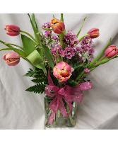 Tulips arranged in a vase (colors may vary) 