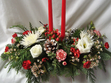 TWO   WHITE CANDLE CHRISTMAS CENTERPIECE WITH RED AND WHITE FLOWERS, PINE CONES, CHRISTMAS GREENS, ETC.