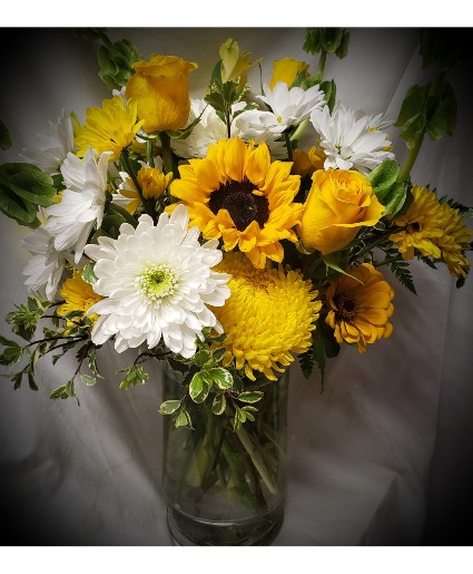 Vase of bright yellow and white flowers! 