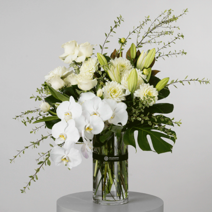 vase, white orchid, roses, amaryllis centerpiece