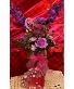 Vase with a beautiful Mix of flowers and chocolate Fresh flowers in glass vase with Heart shaped box of chocolate
