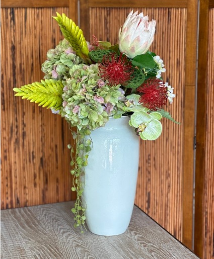 Verdant Serenity  Faux antique hydrangea's with protea and orchids .