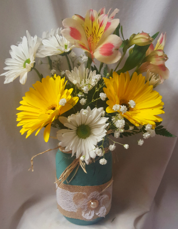 Cute Burlap flower mason jar with gerbera daisies Astramaria Lilly and filler with daisies.