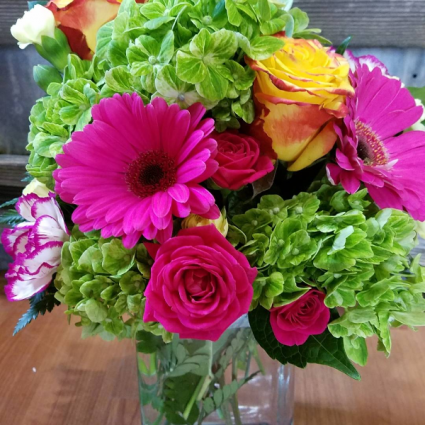 Vibrant Hues vase with green hydrangea, hot pink gerbs, yellow roses