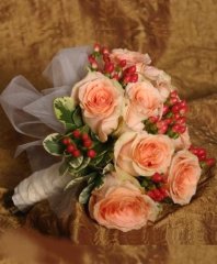 Coral Roses & Red Hypericum Bridal Wedding Bouquet in Ozone Park, NY | Heavenly Florist
