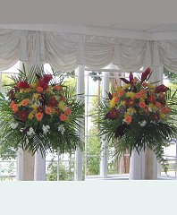 Flowers Displayed on Columns Reception Arrangements