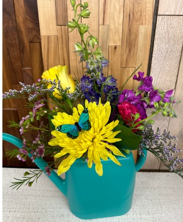 Watering Can Garden Arrangement Mixed Flower in Greenfield, IA | COLORS FLORAL & HOME DECORATING