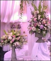 Floral Arrangements on Pedestals Display Wedding Reception Flowers