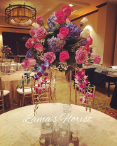 Wedding centerpiece with roses and orchids 