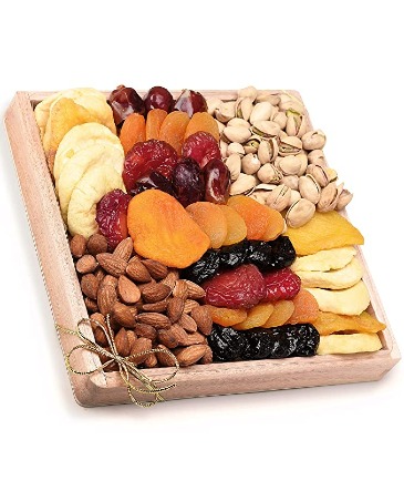 Welcome arrival wooden tray of dried fruits and nuts in Key West, FL | Petals & Vines