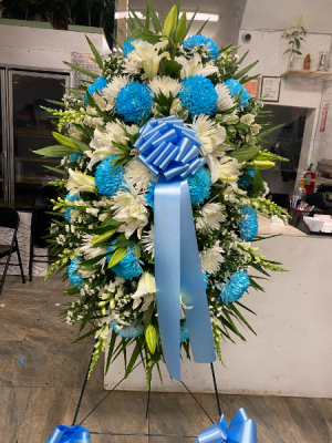White and blue flowers with lilies We are so sorry for your loss