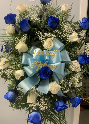 white and blue roses standing spray