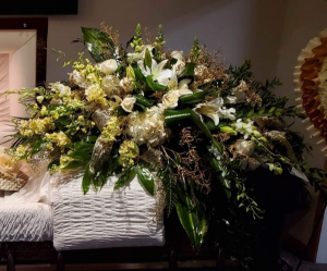 WHITE AND GOLD REST CASKET FLOWERS