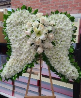 white angel wings  standing wreath funeral