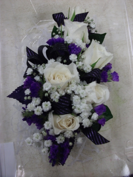 purple and white corsage