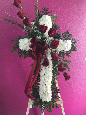White cross with red roses 