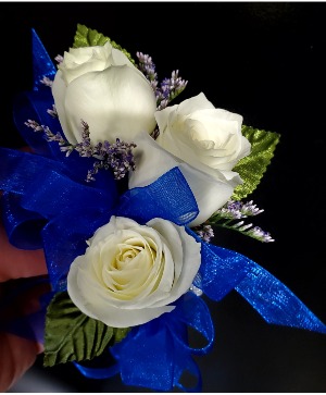 white flower corsage with blue ribbon white flower corsage with blue ribbon