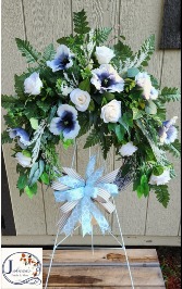 White grapevine wreath on easel 