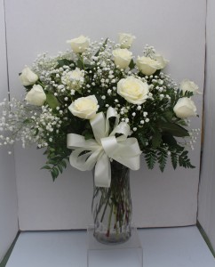 White Long Stem Roses Arranged in Glass Vase