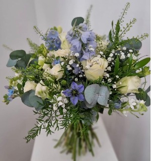white rose and blue tweedia bouquet 
