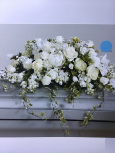 White roses, stock and English Ivy Casket piece