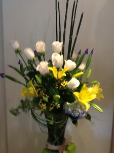 white roses yellow lilies vase