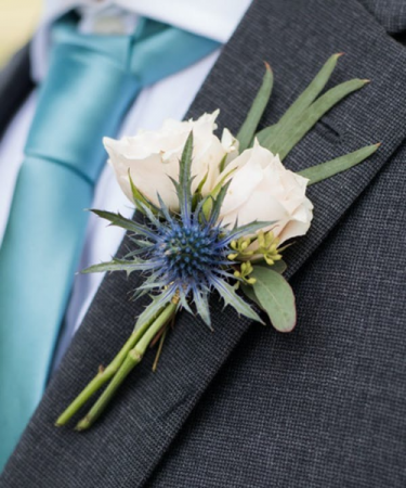 White Spray Rose and Blue Thistle Boutonniere