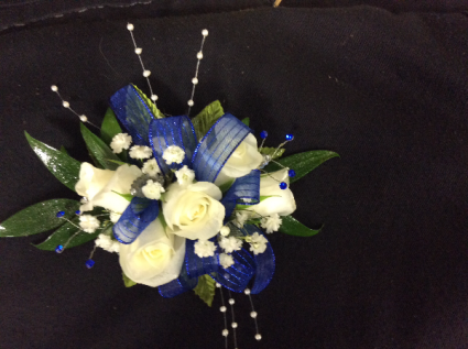 WHITE SPRAY ROSE WITH ROYAL BLUE ACCENTS CORSAGE