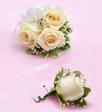 White sweetheart rose corsage with  matching bout! 