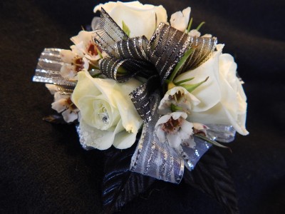 White Sweetheart Roses With Black/Silver Accents Corsage