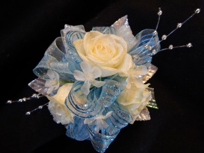 White Sweetheart Roses/Light Blue/Silver Accents  Corsage