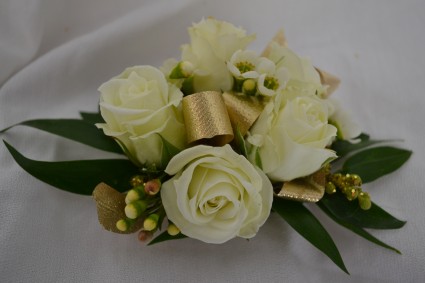 white with gold wrist corsage