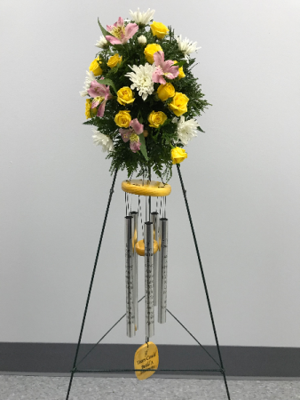 seasonal flowers with assorted windchimes funeral