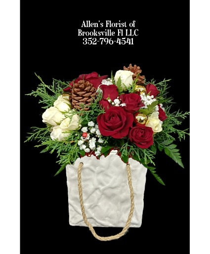 Winter Elegance Holiday Bag Fresh cut flowers in a ceramic container