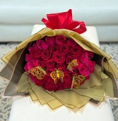 WRAPPED RED AND PINK ROSES WITH GOLD BUTTERFLIES 